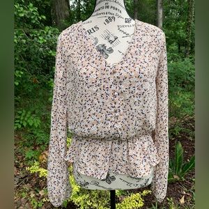 Floral blouse with navy, white and tan fabric.